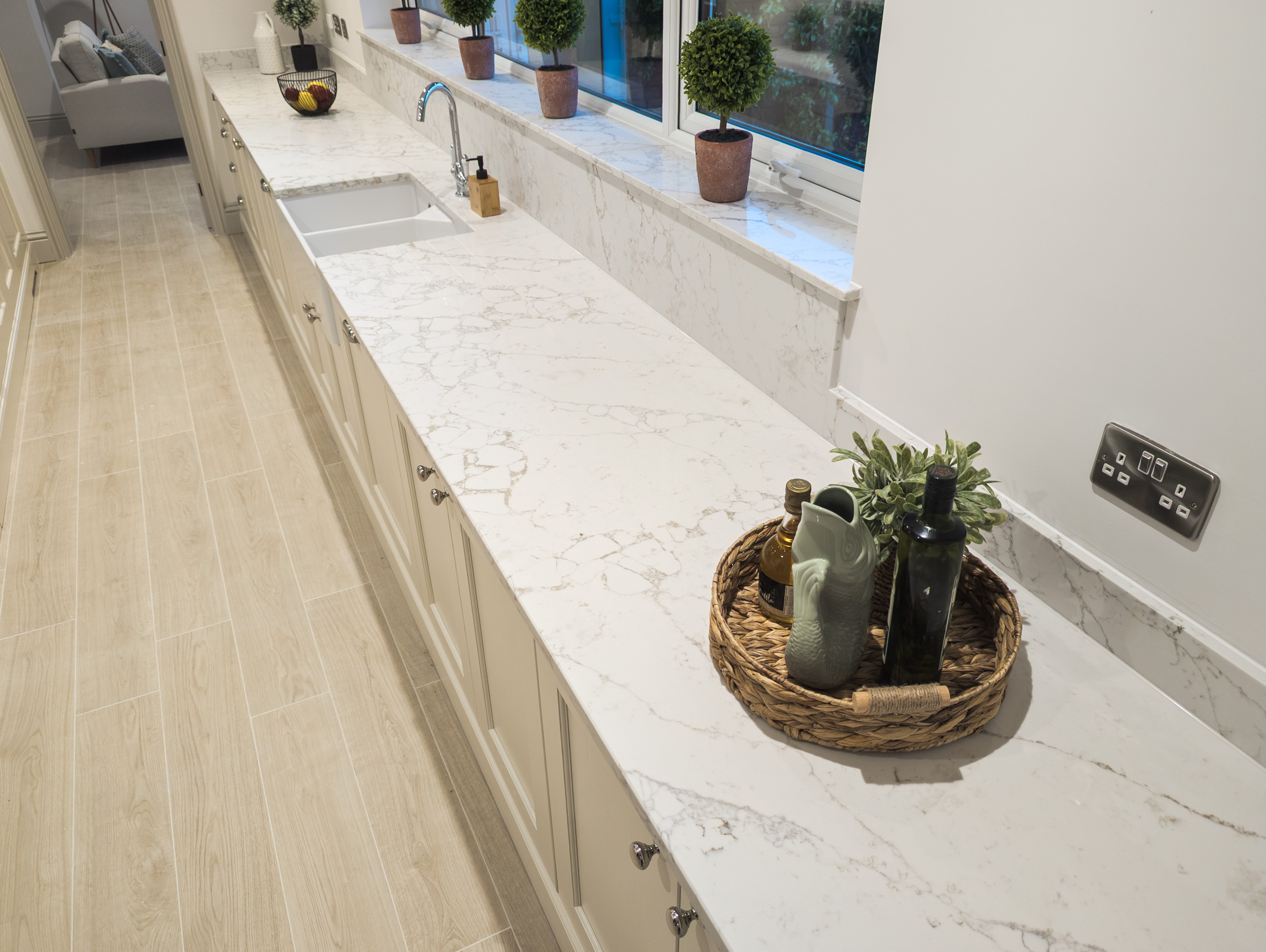 Arabescato Cremo quartz worktop lit by natural side-lighting in a Welwyn Garden City kitchen
